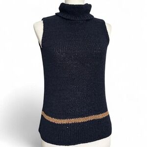 Sleeveless eyelet knit turtleneck by Norton McNaughton